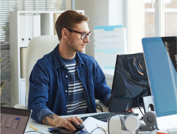 Man searching on his pc for Hybrid software to complement the AV technologies of his company.