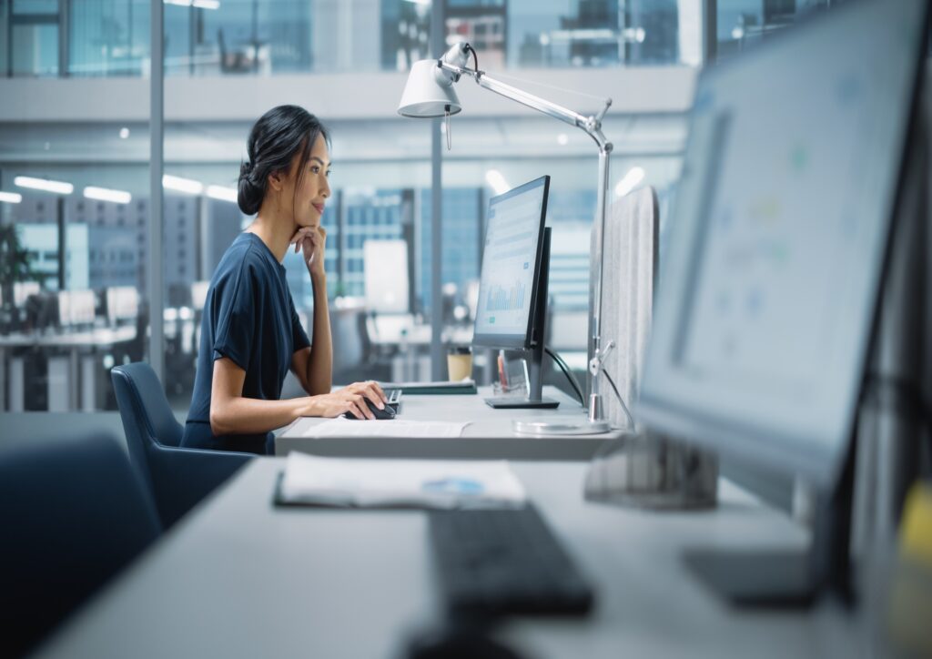 A woman working on organizing a scientific conference with the help of AI.