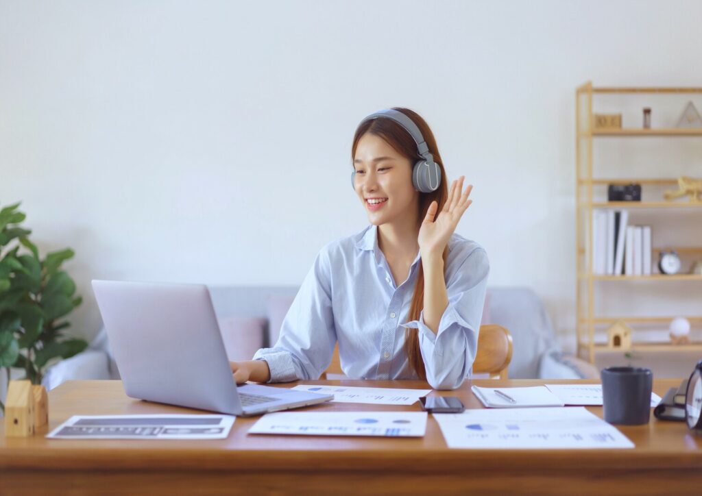 A woman participating in a gamification activity during a virtual meeting supported by CTI.