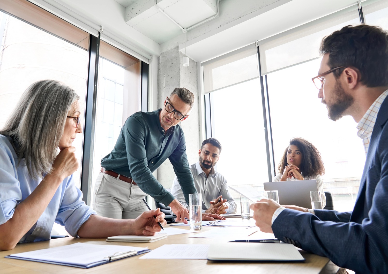 A group of event organizers creating an effective marketing strategy for their next scientific event.