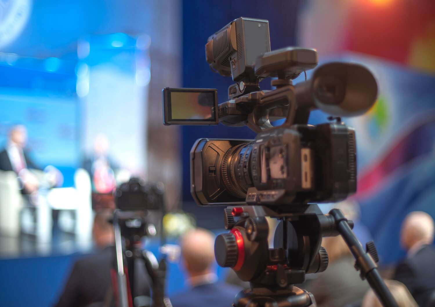 A camera filming the speakers during a scientific conference.